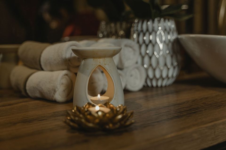 Candles and rolled towels in a spa